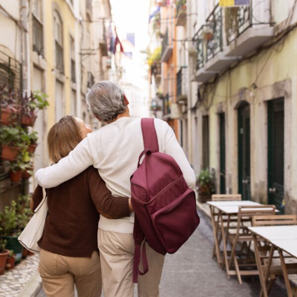 senior-couple-hugging-walking-on-lisbon